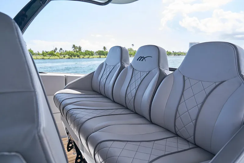 Slide: The Image of Luxurious seating on 2018 Midnight Express 43 Open boat with scenic water view. - 45