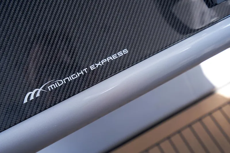 Slide: The Image of 2018 Midnight Express 43 Open boat with carbon fiber detailing and logo. - 47