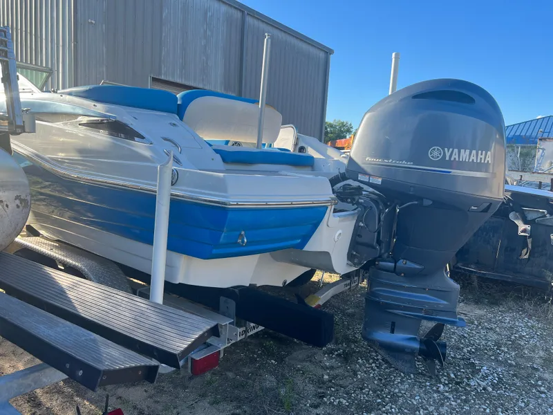 Slide: The Image of 2018 Crownline Eclipse E21 XS boat with Yamaha outboard motor on trailer. - 11