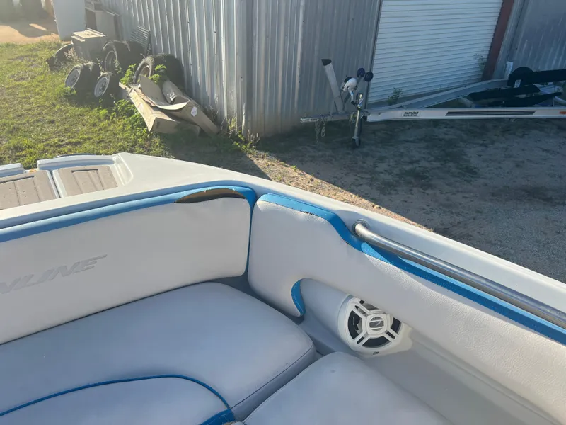 Slide: The Image of 2018 Crownline Eclipse E21 XS boat interior with white and blue seating. - 17