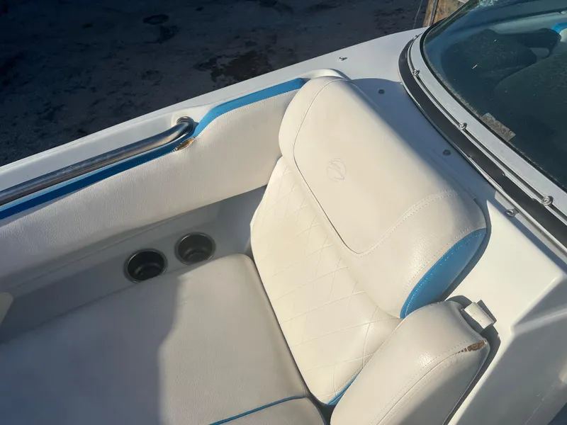 Slide: The Image of 2018 Crownline Eclipse E21 XS boat interior with white and blue seating. - 18
