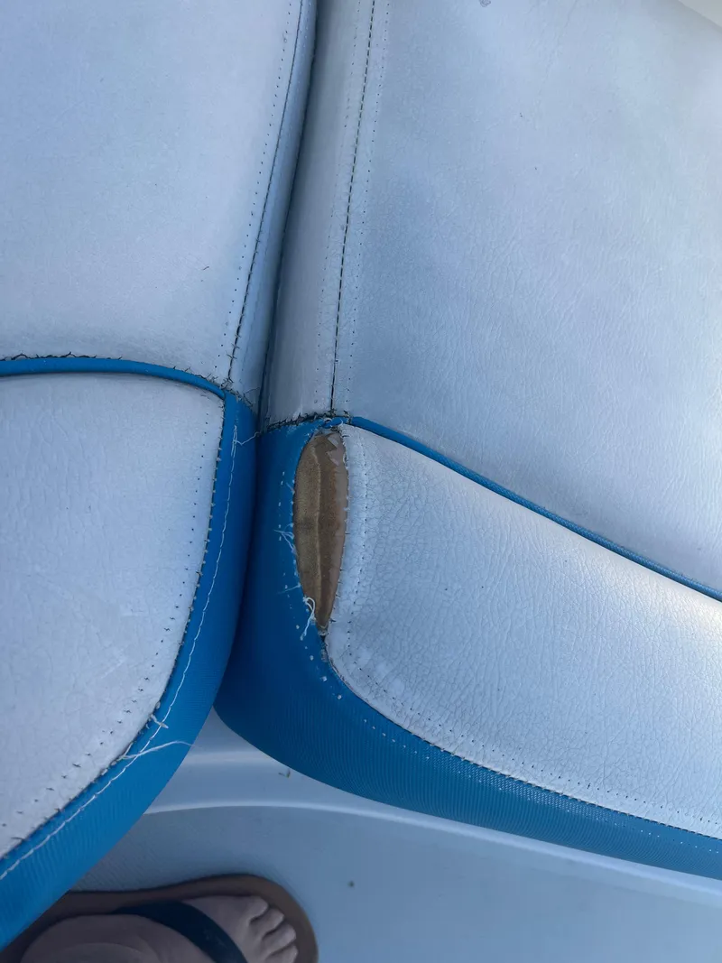 Slide: The Image of Torn upholstery on a 2018 Crownline Eclipse E21 XS boat seat. - 19