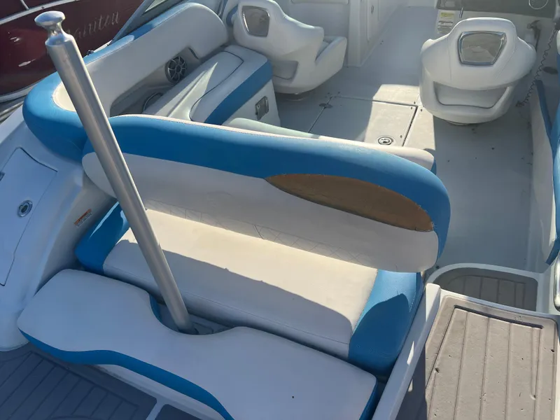 Slide: The Image of 2018 Crownline Eclipse E21 XS boat interior with blue and white seating. - 22