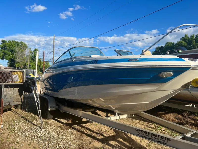 Slide: The Image of 2018 Crownline Eclipse E21 XS boat on trailer under blue sky. - 9