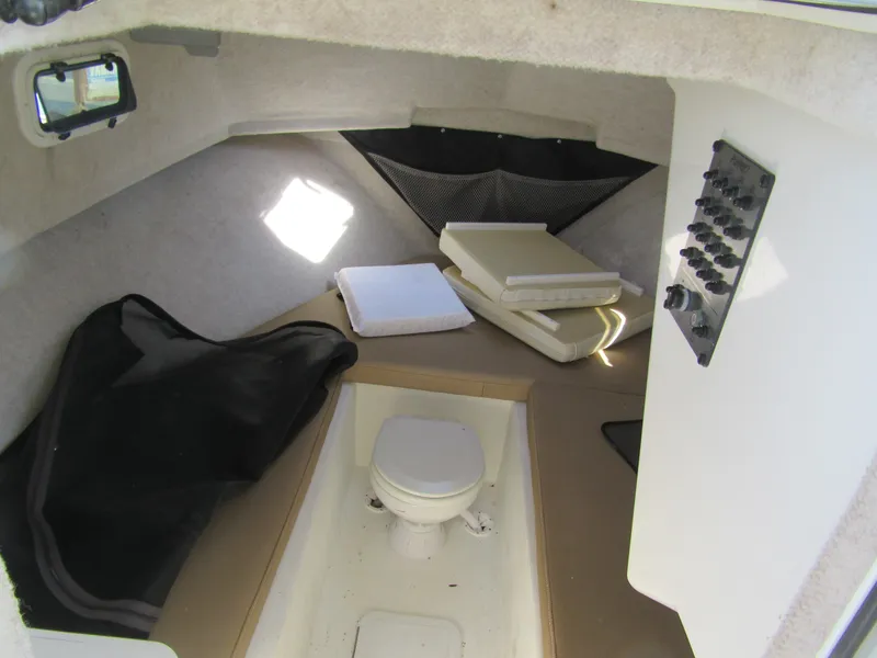 Slide: The Image of 2019 Parker 2810 XLD Walkaround cabin interior with toilet and storage. - 17