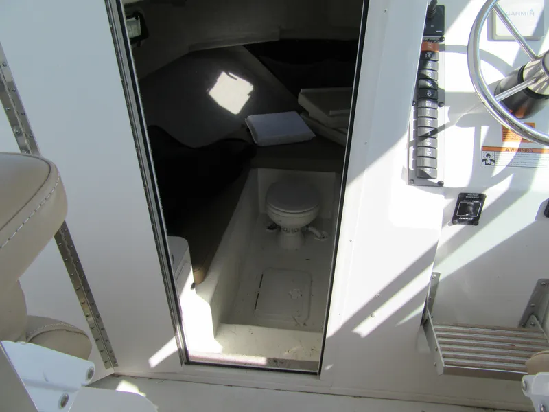 Slide: The Image of 2019 Parker 2810 XLD Walkaround cabin interior with toilet and seating area. - 18