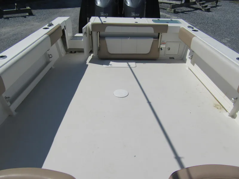 Slide: The Image of 2019 Parker 2810 XLD Walkaround boat deck with seating and storage compartments. - 7