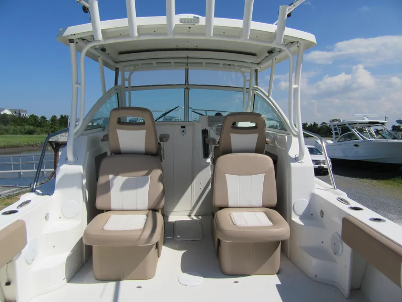 Slide: The Image of 2019 Parker 2810 XLD Walkaround boat interior with dual captain's chairs. - 8