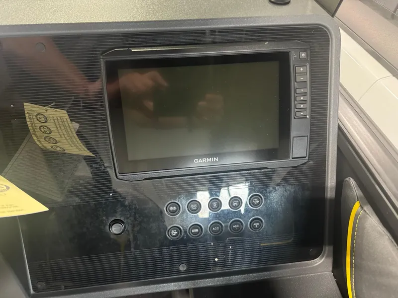 Slide: The Image of 2024 Manitou Explore dashboard with Garmin display and control panel. - 5