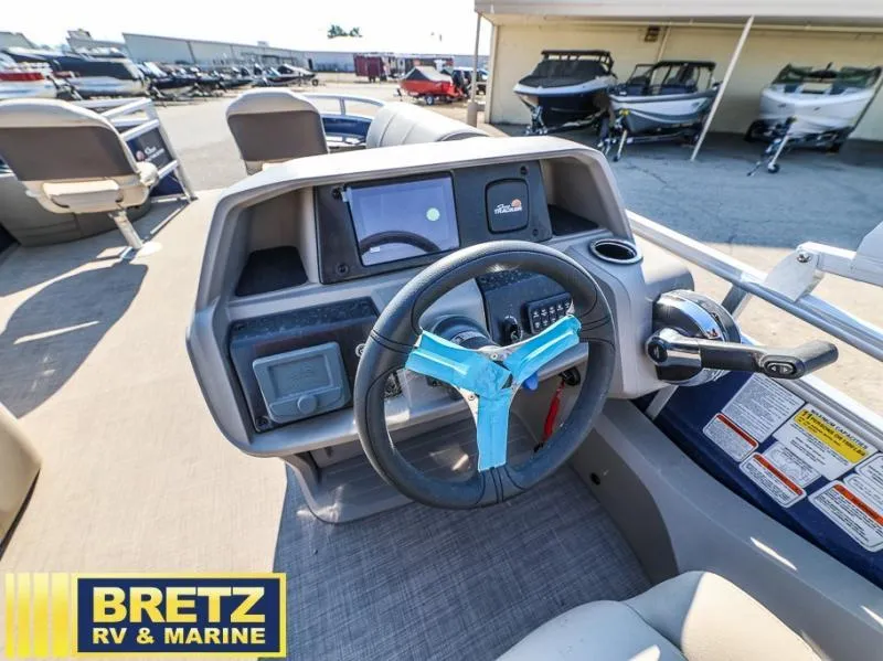 Slide: The Image of 2024 Fishin' Barge 22 DLX dashboard at Bretz RV & Marine dealership. - 11