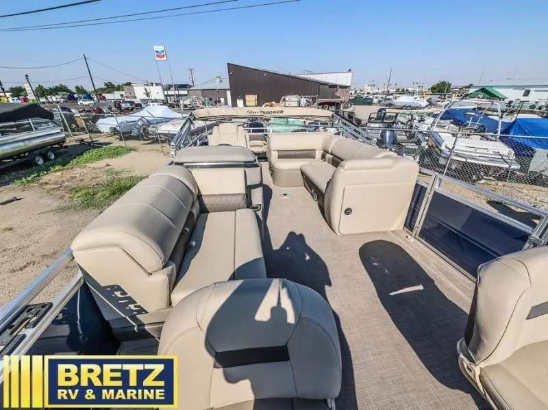 Slide: The Image of 2024 Fishin' Barge 22 DLX pontoon boat interior at Bretz RV & Marine dealership. - 7