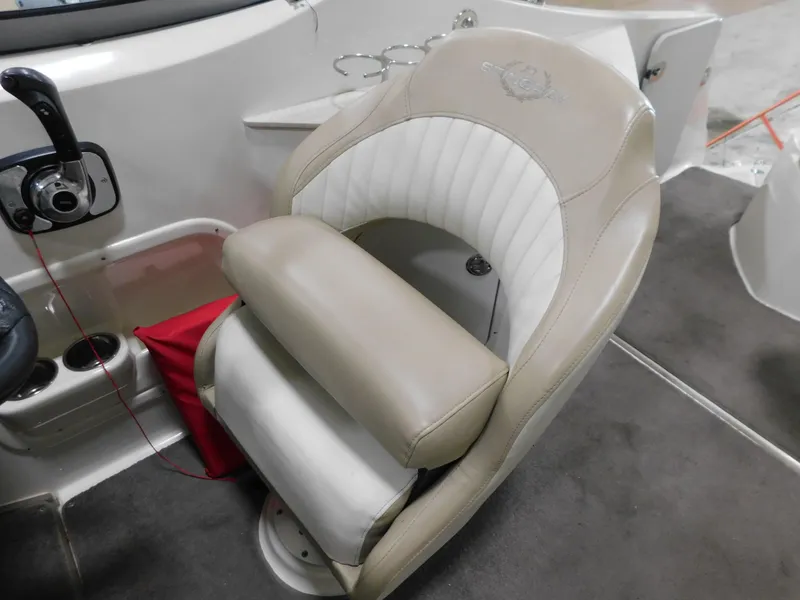 Slide: The Image of 2015 Stingray 250 CS boat seat with beige and white upholstery. - 17