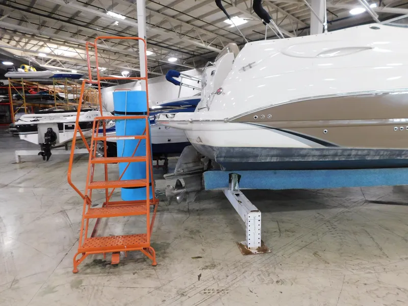 Slide: The Image of 2015 Stingray 250 CS boat in storage facility with orange ladder nearby. - 3