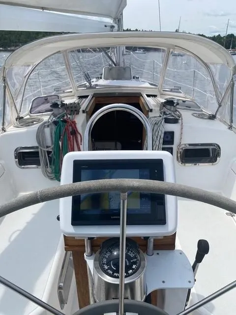 Slide: The Image of Cockpit view of 1993 Freedom 35 sailboat with navigation equipment and steering wheel. - 17