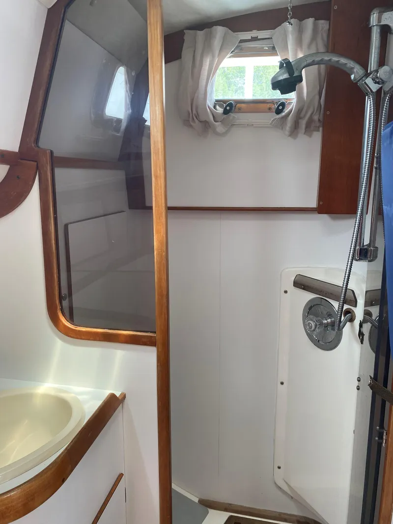 Slide: The Image of Interior of 1993 Freedom 35 sailboat bathroom with shower and sink. - 19