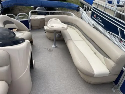 Slide: The Image of 2016 Sun Tracker Fishin' Barge 20 DLX pontoon boat interior with beige seating. - 9