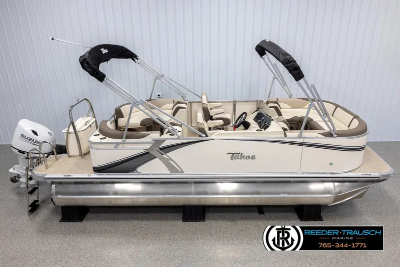 Slide: The Image of 2024 Tahoe LTZ QL pontoon boat with Suzuki outboard motor. - 1