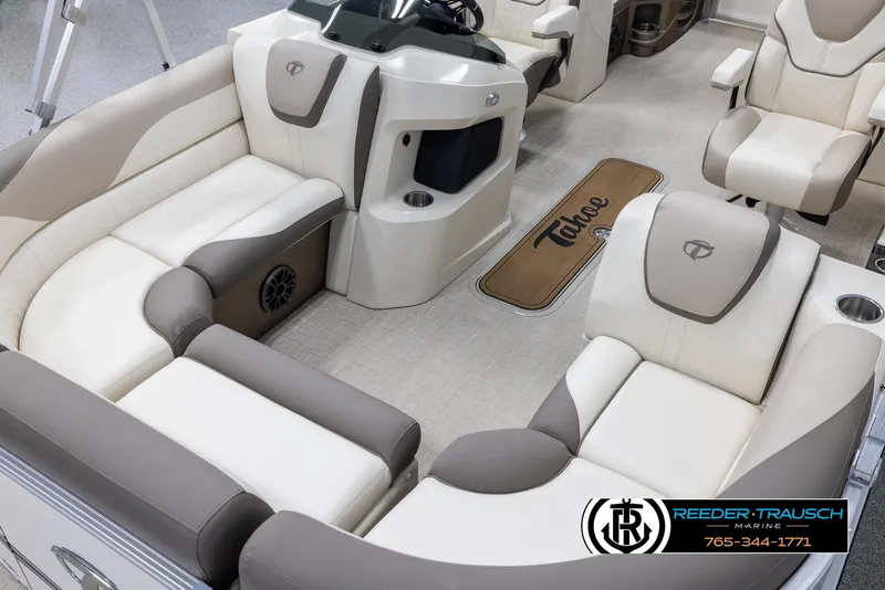 Slide: The Image of 2024 Tahoe LTZ QL boat interior with beige and brown seating, Reeder-Trausch Marine logo. - 10