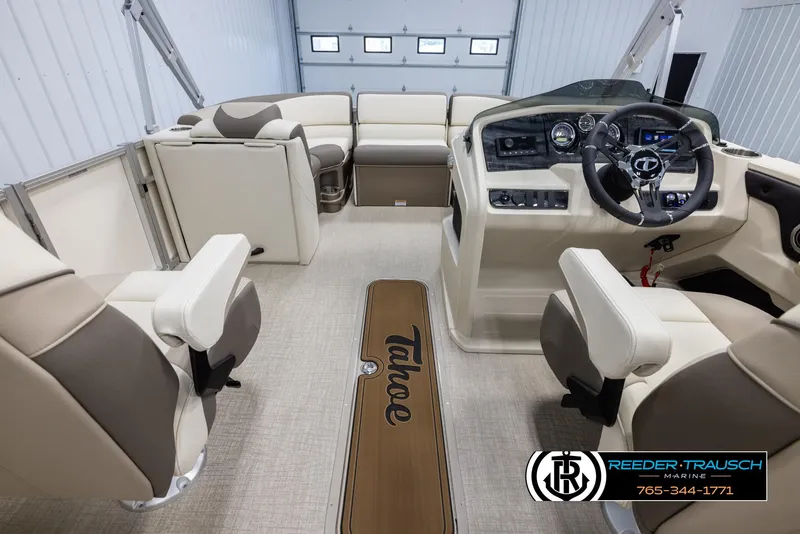 Slide: The Image of 2024 Tahoe LTZ QL boat interior with beige and brown seating, steering console, and Reeder-Trausch Marine logo. - 17