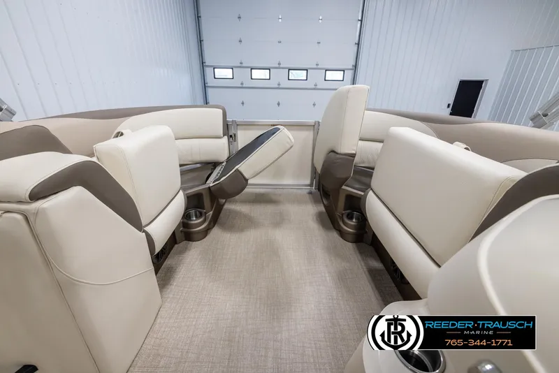 Slide: The Image of 2024 Tahoe LTZ QL boat interior with beige and brown seating. - 20