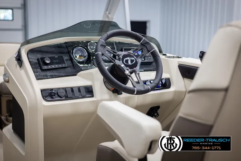Slide: The Image of 2024 Tahoe LTZ QL boat dashboard and steering wheel. - 24