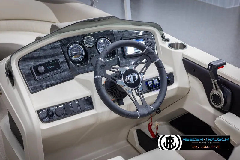 Slide: The Image of 2024 Tahoe LTZ QL boat dashboard with steering wheel and control panel. - 25