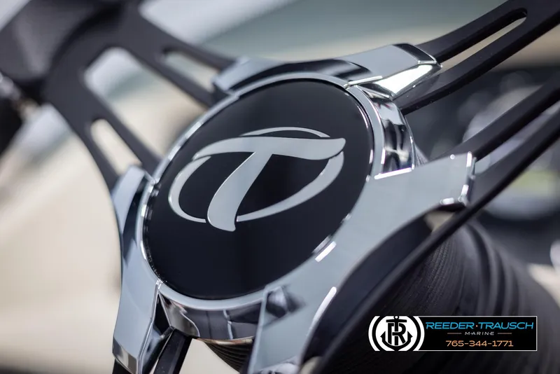 Slide: The Image of Close-up of 2024 Tahoe LTZ QL steering wheel with logo. - 26