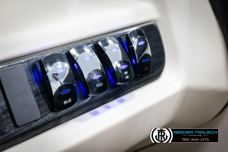 Slide: The Image of 2024 Tahoe LTZ QL control panel with illuminated switches. - 30