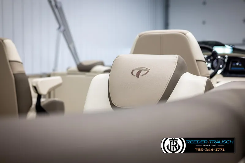 Slide: The Image of 2024 Tahoe LTZ QL boat interior with beige leather seats. - 32