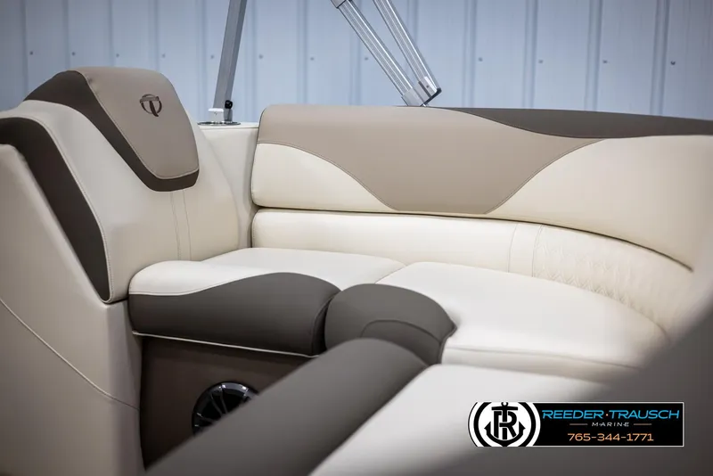 Slide: The Image of 2024 Tahoe LTZ QL boat interior with beige and brown leather seating - 34