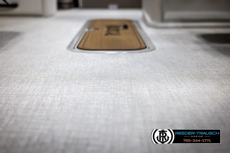 Slide: The Image of 2024 Tahoe LTZ QL boat interior flooring with Reeder-Trausch Marine logo. - 40
