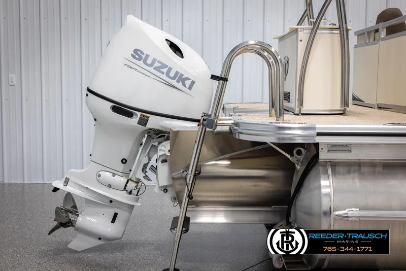 Slide: The Image of 2024 Tahoe LTZ QL pontoon boat with Suzuki outboard motor in showroom. - 41