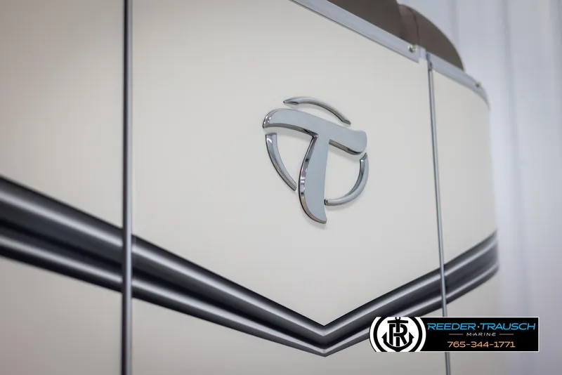 Slide: The Image of 2024 Tahoe LTZ QL boat with logo and Reeder-Trausch Marine branding. - 46