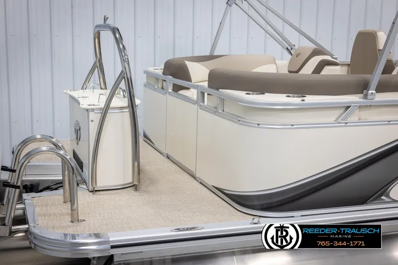 Slide: The Image of 2024 Tahoe LTZ QL pontoon boat with beige seating and stainless steel ladder. - 48