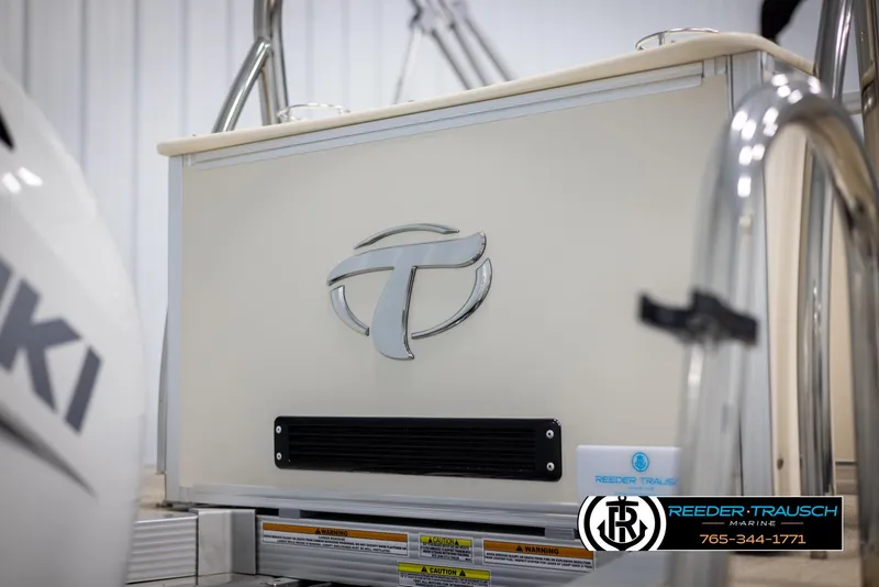 Slide: The Image of 2024 Tahoe LTZ QL boat rear view with logo and Reeder-Trausch Marine branding. - 49