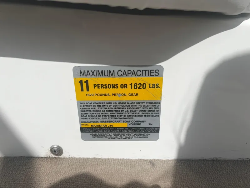 Slide: The Image of Maximum capacity label on 2001 MasterCraft X-10 boat: 11 persons or 1620 lbs. - 12
