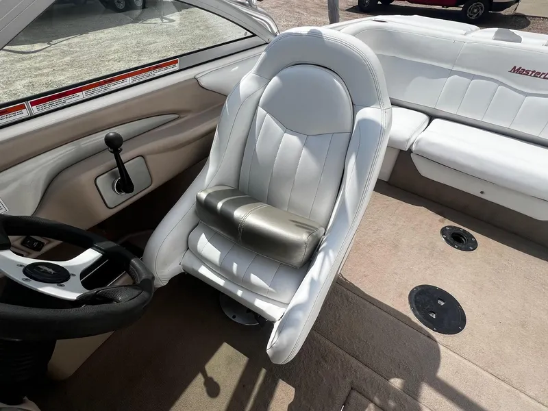 Slide: The Image of Interior of a 2001 MasterCraft X-10 boat with white leather seats and steering wheel. - 15