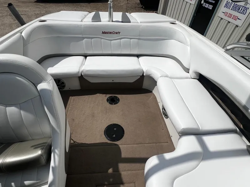 Slide: The Image of 2001 MasterCraft X-10 boat interior with white leather seating and beige carpet. - 16