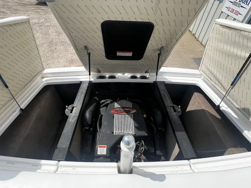 Slide: The Image of 2001 MasterCraft X-10 boat engine compartment with open hatches. - 18