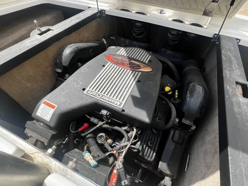 Slide: The Image of 2001 MasterCraft X-10 boat engine compartment with visible engine components. - 19