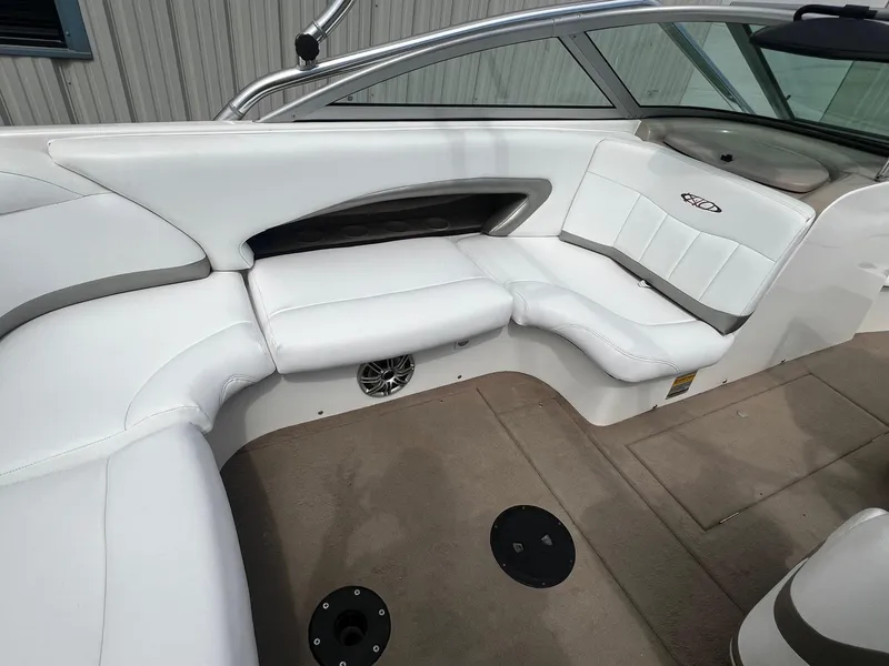 Slide: The Image of 2001 MasterCraft X-10 boat interior with white leather seating and beige flooring. - 22