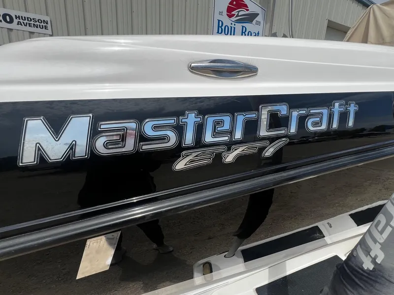 Slide: The Image of 2001 MasterCraft X-10 boat with EFI logo at Boji Boat dealership. - 26