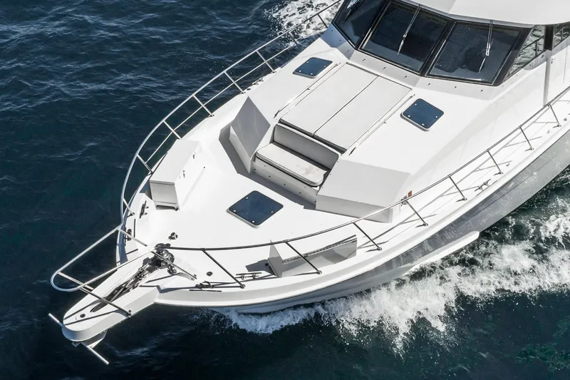 Slide: The Image of 1996 Hatteras 70 Sport Deck Motor Yacht cruising on the ocean. - 3