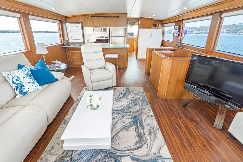 Slide: The Image of Luxurious interior of 1996 Hatteras 70 Sport Deck Motor Yacht with modern furnishings. - 32