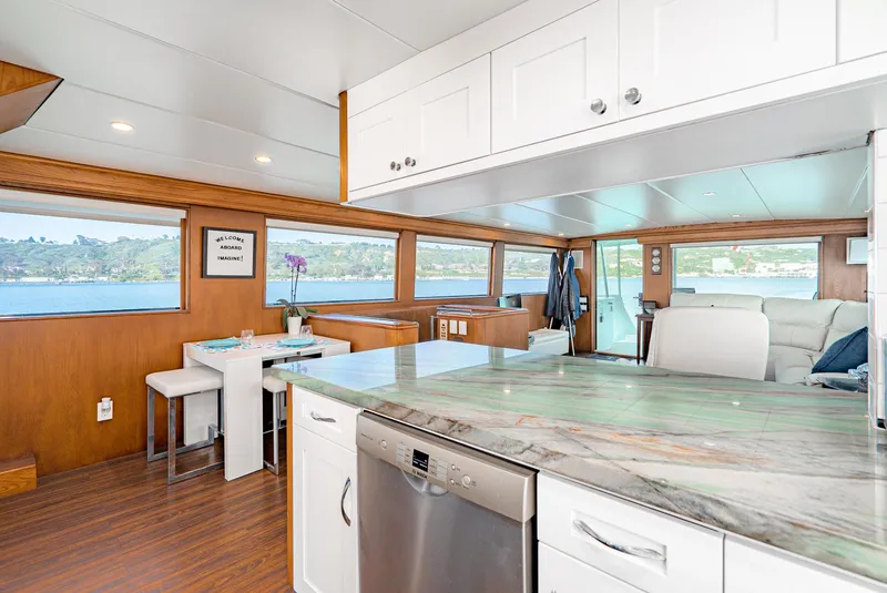 Slide: The Image of Interior of 1996 Hatteras 70 Sport Deck Motor Yacht with modern kitchen and scenic windows. - 35
