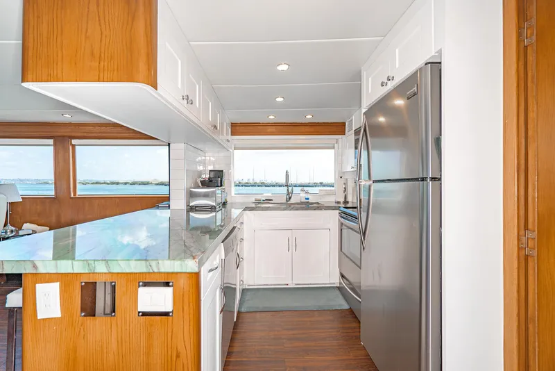 Slide: The Image of Modern kitchen in 1996 Hatteras 70 Sport Deck Motor Yacht with stainless steel appliances. - 36