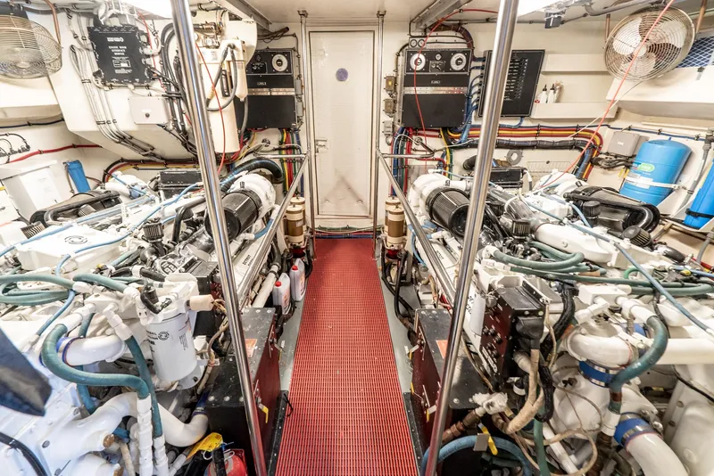 Slide: The Image of Engine room of a 1996 Hatteras 70 Sport Deck Motor Yacht with twin engines. - 5