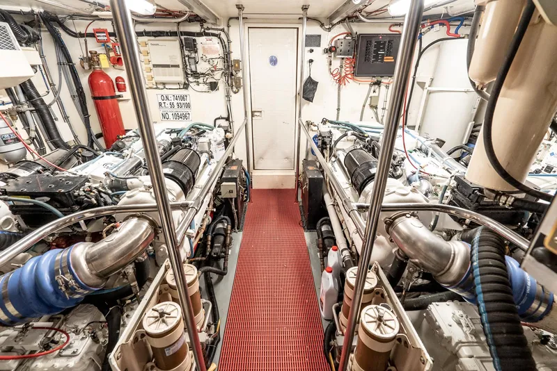 Slide: The Image of Engine room of a 1996 Hatteras 70 Sport Deck Motor Yacht with twin engines. - 6