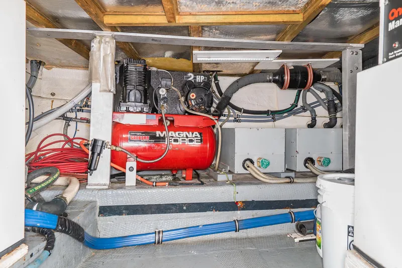 Slide: The Image of Engine room of a 1996 Hatteras 70 Sport Deck Motor Yacht with Magna Force air compressor. - 9