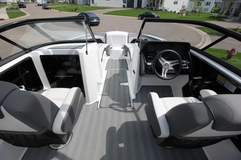 Slide: The Image of 2019 Yamaha Boats 212 Limited S interior cockpit with dual seating and steering console. - 13